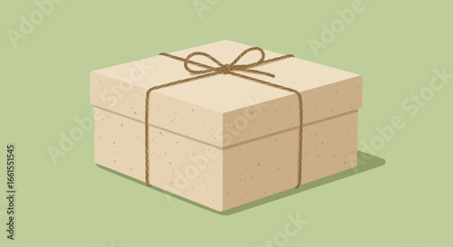 Square gift box tied with string tan with specks casting shadow on a light green background