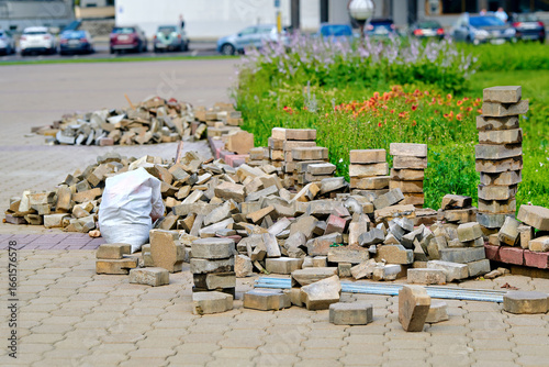 Εκτύπωση καμβά Old paving stone blocks stacked, repair process for urban pavement and infrastructure restoration