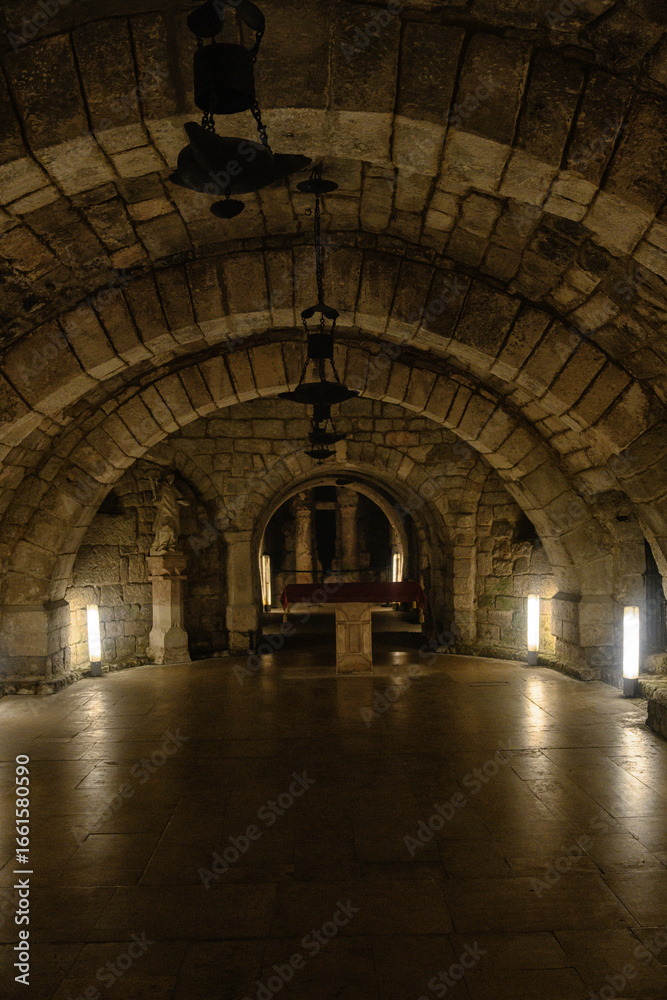 Obraz premium Underground stone crypt with arches in San Antolin Cathedral, Palencia