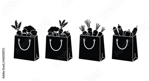 Four black shopping bags filled with various fresh vegetables and herbs