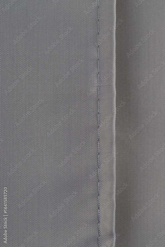 Fototapeta premium a neat seam on the gray polyester material