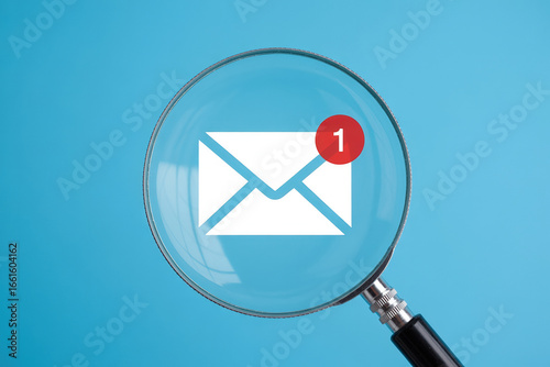 Investigating Low Feedback Email Notifications A Magnifying Glass Focuses on a New Message Icon Against a Light Blue Background for Review