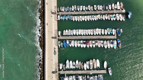 Aerial drone view of Torre a Mare in Puglia, southern Italy, showcasing the scenic coastline, marina with moored boats