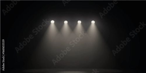 Bright spotlights illuminate an empty dark stage, ready for the show
