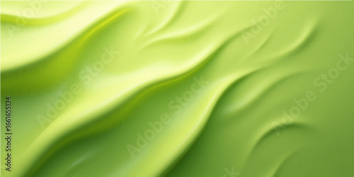 Soft flowing green satin silk fabric with a smooth textile texture and liquid waves pattern