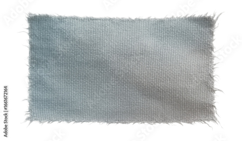 Fragment of synthetic fabric with frayed edges and faded color