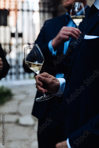 man holding a glass of wine
