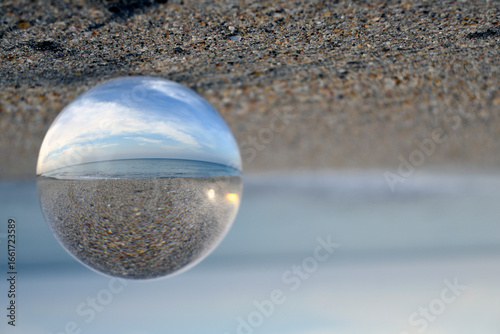 glass sphere on the beach