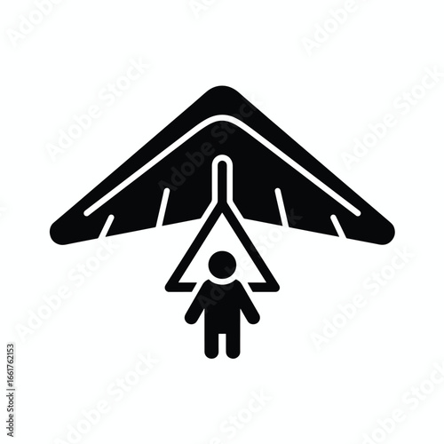 Hang gliding silhouette: a person suspended beneath a glider wing.