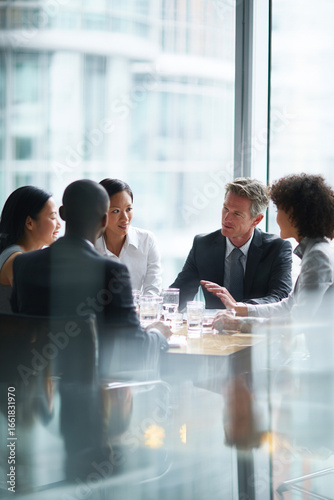 Business men and women wearing suit or formal outfit, discussing at their meeting with co-worker and client at   modern office in urban building. 