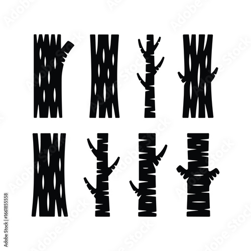 Set of stylized black tree trunks with branches on a white background