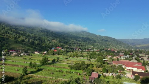 Aerial Drone Footage of Mountain Meadow with Low-Hanging Clouds – Misty Forest Panorama
