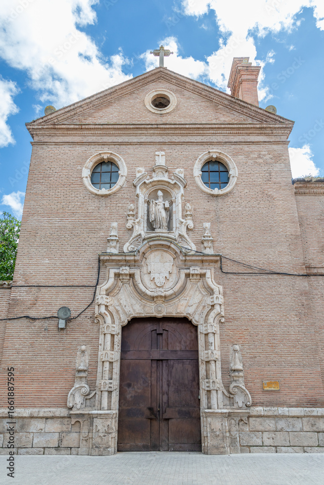 Fototapeta premium Alcala de Henares - May 5, 2025: Classic buildings in the historic center of Madrid, called Alcala de Henares, Spain