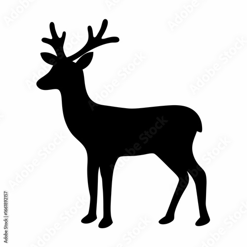 Black silhouette of majestic deer with antlers standing in elegant pose