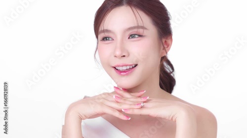 Happy young Asian beauty woman model natural make up cosmetic on face radiant eyes lip gloss happy touch her perfect fresh glow and smooth skin. Female model skincare Facial concept.