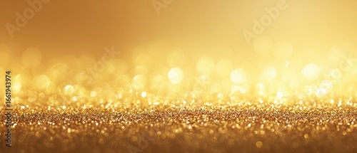 The shimmering gold glitter background creating a warm and luxurious atmosphere.