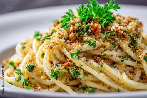 Spaghetti served with breadcrumbs and herbs in a restaurant setting during lunchtime