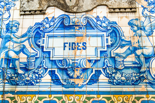 Porto, Portugal - July 9 2025: The ceramic Tile decoration on the facade of Saint-Ildefonse Church in Lisbon Portugal