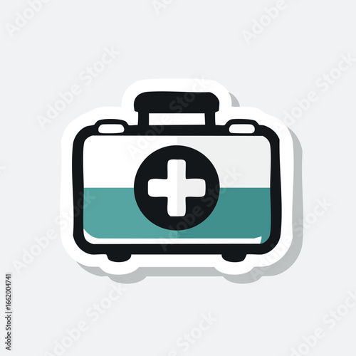 A sticker of a first aid kit with a white cross on a black circle.