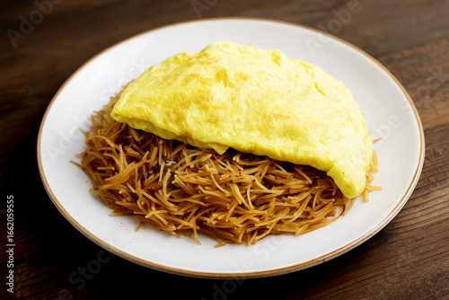 Balaleet - traditional Arabic breakfast. Sweet vermicelli with saffron, cardamom and egg omelette. Arabic, Emirati food. stock photo 