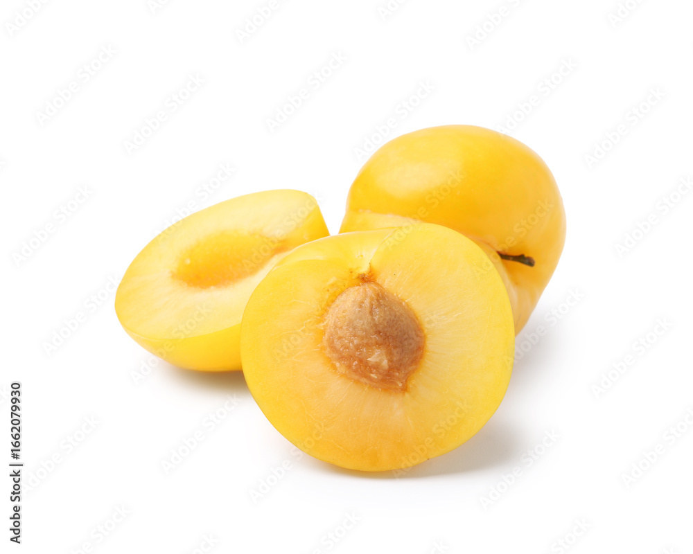 Whole and cut yellow cherry plums isolated on white Whole and cut yellow cherry plums isolated on white