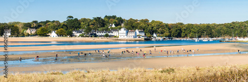 Guidel morbihan clohars carnoet finistere Sandy Beach with Seaside Village in the Distance
