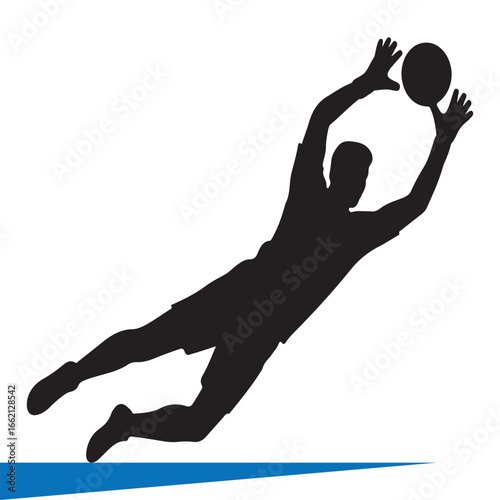 Silhouette of a soccer goalkeeper diving to catch the ball