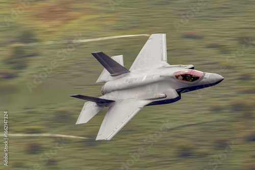 F35 fighter jet aircraft military aviation stealth fighter in flight, air force combat aircraft at low level. 
