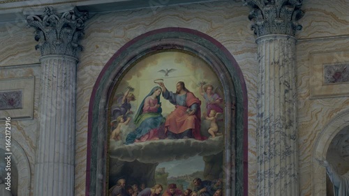 Fresco depicting coronation of Virgin Mary between Corinthian marble columns inside historic basilica
