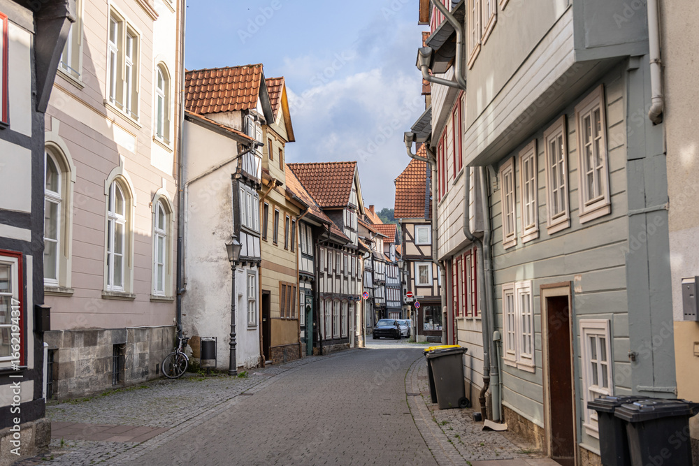 Fototapeta premium Traditional German architecture with historic half timbered buildings along old cobblestone street in Hann Münden