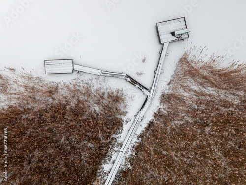 Aerial view of pier with fi...