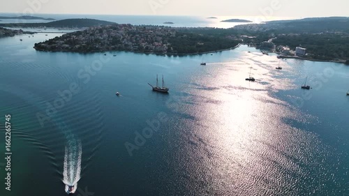 Aerial view of boats sailing across the Adriatic Sea near a coastal Croatian town