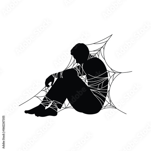 Silhouette of a man trapped in a spiderweb bound and helpless symbolic of depression or anxiety