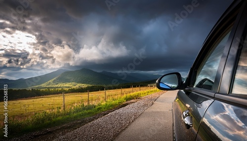 stormy skies reflected in car mirror roadside landscape nature photography dramatic weather close up viewpoint