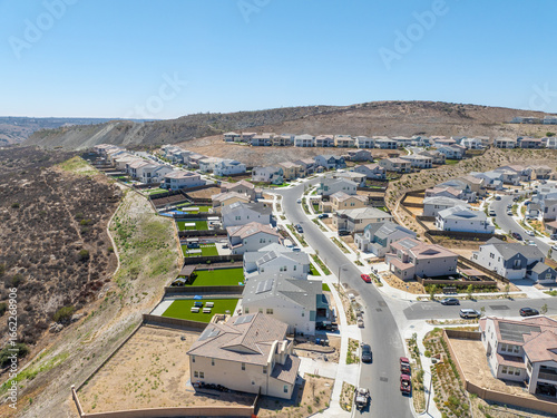 New development real estate. Aerial view of residential houses and driveways neighborhood in south San Diego, Chula Vista. Packed homes. Top view over private houses