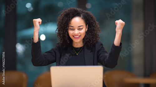 businesswoman cheering after product sale alert