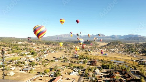 Hot air balloons floating over pagosa springs during a balloon festival
