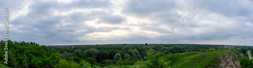 Tableau sur toile A cloudy dawn gently unfolds over a picturesque village in the Poltava region of Ukraine, casting a soft light on the rural landscape