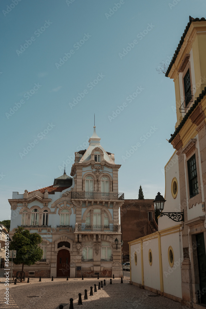 Fototapeta premium Historic pastel blue building with ornate details in the old town of Algarve, Portugal.
