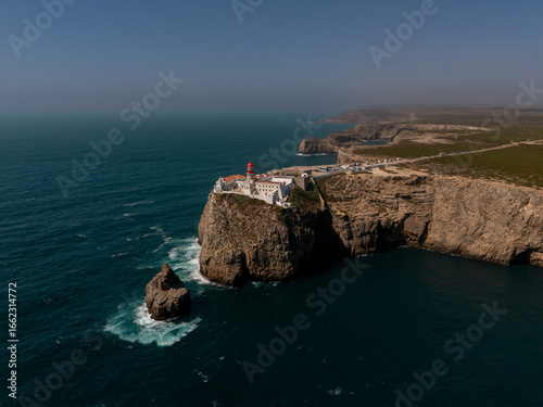 Drone view of Cape St. Vincent lighthouse and coastline cliffs, Sagres, Algarve, Portugal