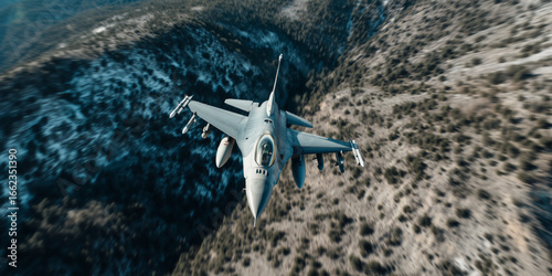 F16 Fighting Falcon flying with high altitude over the mountains