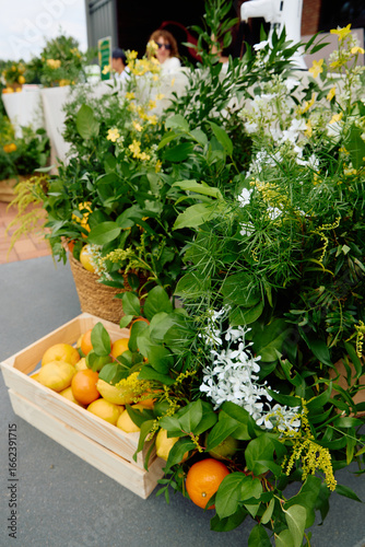 Fresh citrus fruits in lush greenery outdoor arrangement