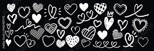 Chalk-drawn hearts on a blackboard. Various heart shapes, heart patterns, and heart designs. Creative heart art, heart doodles, and heart sketches. Hand drawn Valentine's Day vector set.