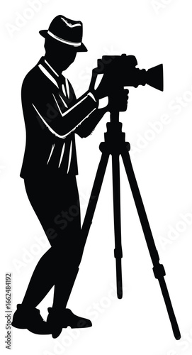 Silhouette of a photographer with a vintage camera on a tripod
