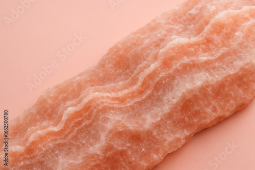 Close-up of Pink Himalayan Salt Block on Soft Pink Background