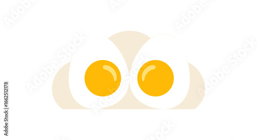 Two perfectly cooked hard boiled eggs halved revealing bright yellow yolks ready for breakfast or a healthy snack