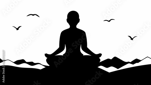 Silhouette of person meditating in lotus position with birds flying above a mountain landscape view