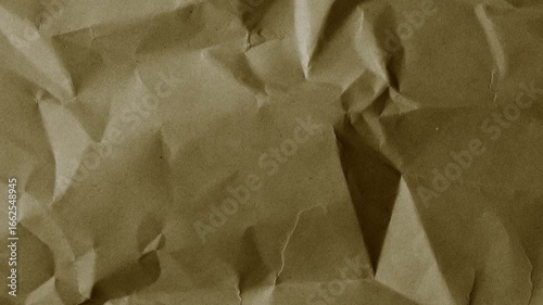 Brown wrinkled paper texture with vintage aged surface. Perfect for use as background, grunge overlay, retro wallpaper, or abstract design element in creative projects.