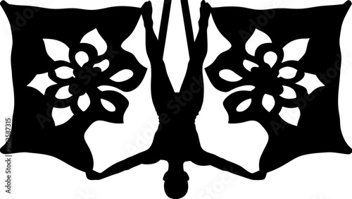 Silhouette of an acrobat performing a handstand with floral patterned flags on either side in black and white