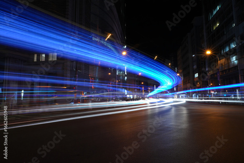 Dynamic City Lights at Night Time Long Exposure Photography Creating Light Streaks in Urban Scenery